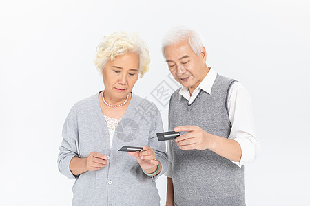 老年夫妻与信用卡高清图片