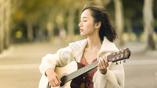 文艺清新美女弹吉他背景图片