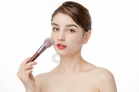 女性化妆涂腮红背景图片
