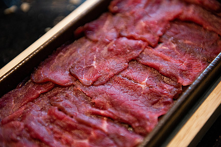 泡椒肥牛火锅食材牛肉片背景