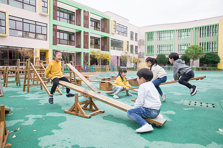 六一儿童幼儿园儿童玩跷跷板背景