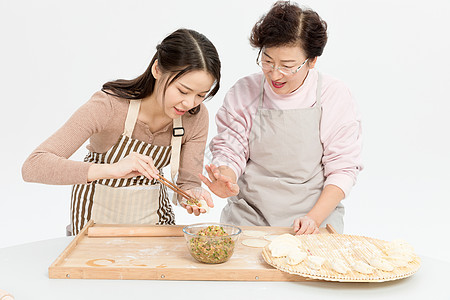 母女做饭母女过节包饺子背景