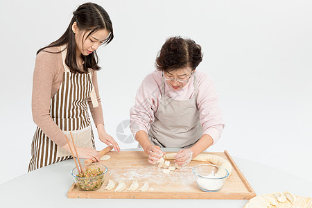 母女做饭母女过节包饺子背景