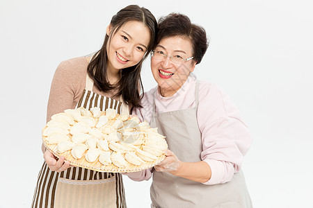 母女过节包饺子背景图片