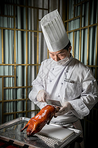 中国大厨片烤鸭背景图片