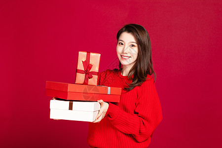 女生抱着礼物盒背景图片