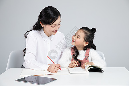 小学生学习老师辅导小朋友学习背景