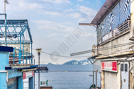 红色背景图香港长洲岛清新海边小楼背景背景