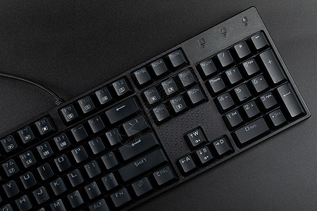 科技黑色背景中的机械键盘背景