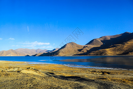 冬天结冰的高原湖泊羊湖羊卓雍措背景图片