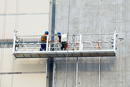 高墙建筑工人背景