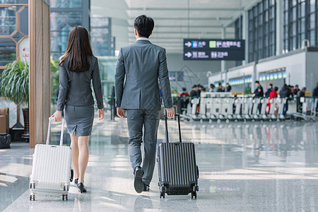 机场情侣商务男女机场背影背景