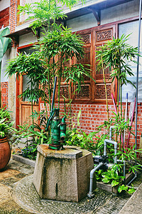 台湾风格金门中式庭院里的老水井背景