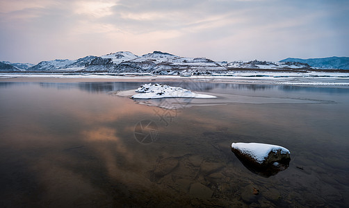 夕阳海雪山风光背景