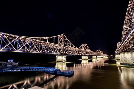 丹东鸭绿江大桥夜景背景图片