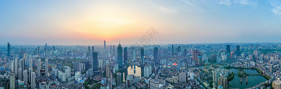 城市商务中心繁华城市建筑群夕阳落日全景长图背景