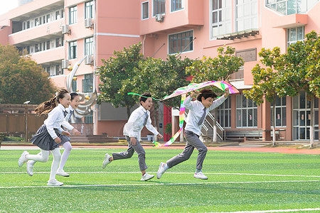 学生开心儿童节小学生追逐放风筝背景