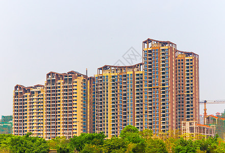 小区停车在建住宅楼背景