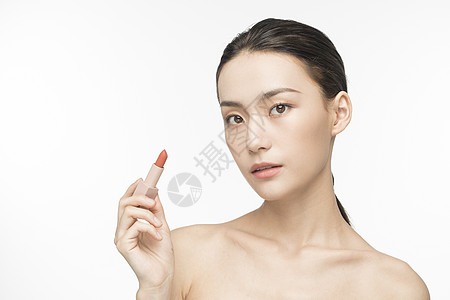 女性化妆涂口红背景图片