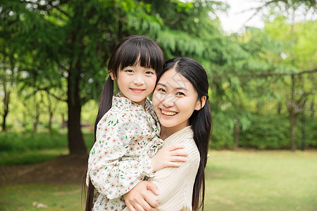 年轻妈妈可爱母女背景