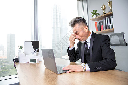 中年商务男士商务男士工作疲劳背景