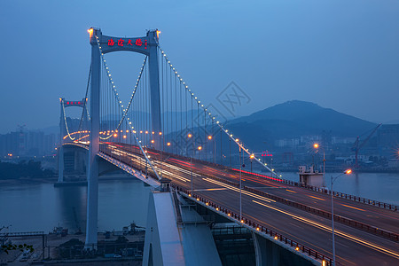 建筑外墙夜景厦门海沧大桥背景