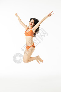 泳装美女跳跃背景图片