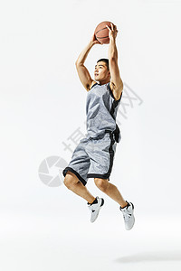 篮球运动员扣篮动作背景图片
