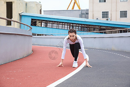 运动女性起跑背景图片