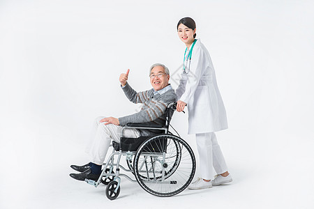 轮椅老人与护工背景图片