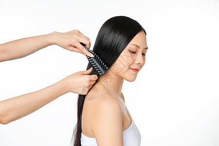 女性护发梳头背景图片