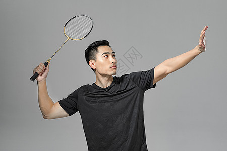 运动男性打羽毛球背景
