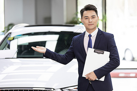 汽车4S店男销售卖车背景