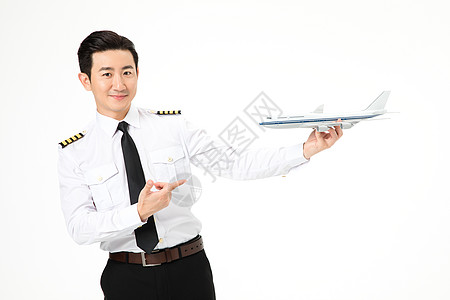 机长飞行员拿着飞机模型图片