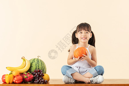 抱着南瓜的女孩们小女孩抱着南瓜背景