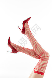 女性穿着红色丝袜和红色高跟鞋图片