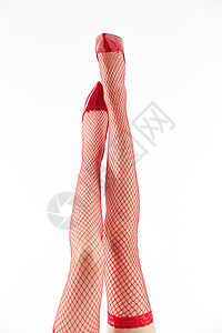 女性穿着红色丝袜和红色高跟鞋俯拍特写背景图片