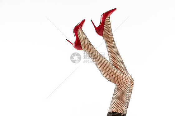 女性穿着黑色丝袜和黑色高跟鞋特写图片