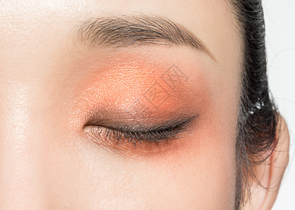 橘色色花特写女性眼部美妆特写背景