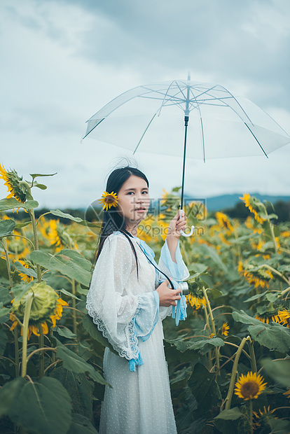 向日葵少女拿着雨伞图片