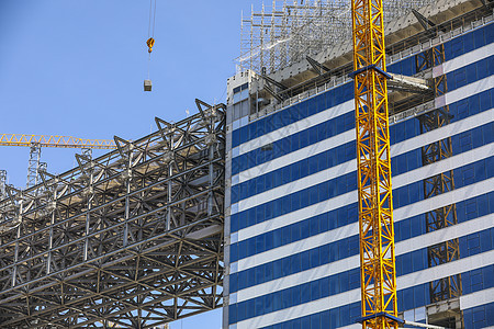 建设工地的建筑和塔吊施工高清图片素材