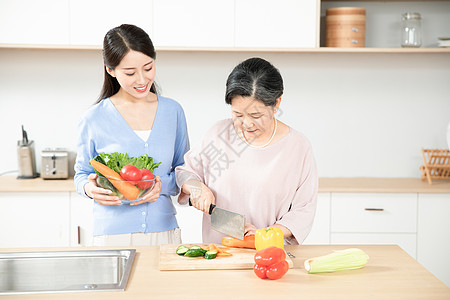 母女做饭母女厨房切菜背景