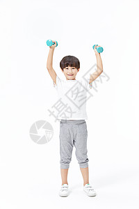 少年儿童男孩使用哑铃锻炼背景