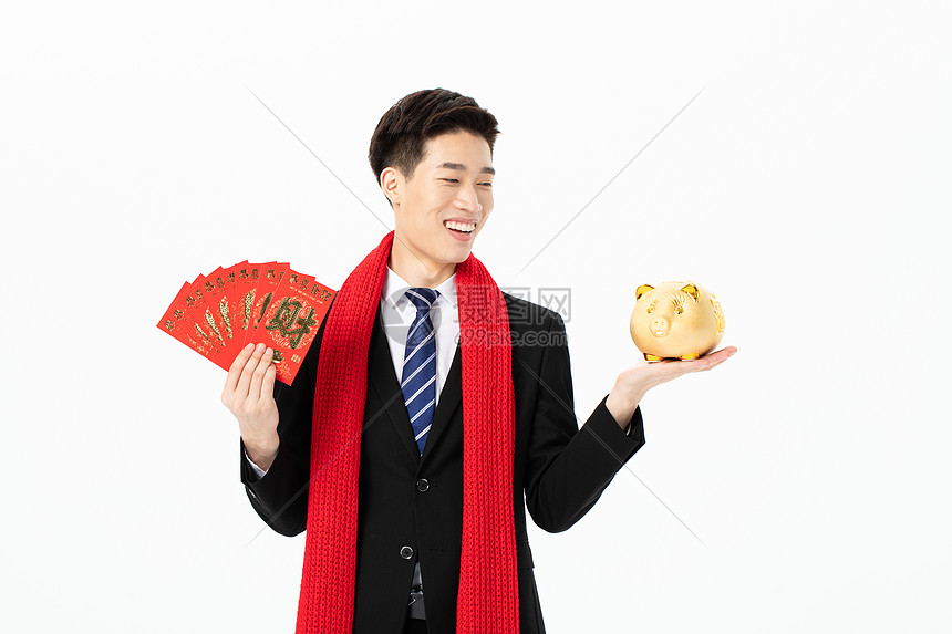 商务男性拿红包和存钱罐图片