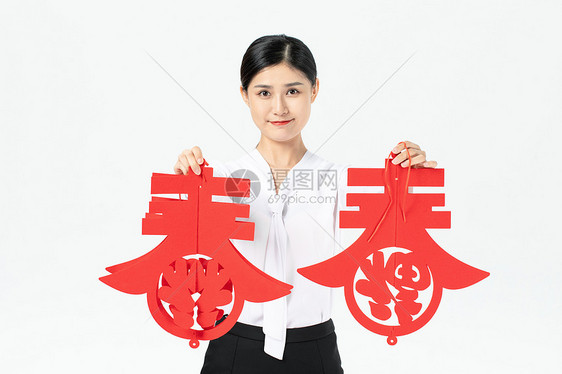 商务美女拿新年挂件迎新年图片