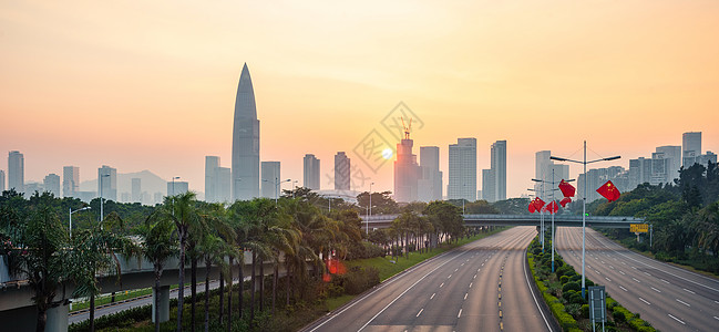 道路建设夕阳下的深圳华润春笋总部大厦背景