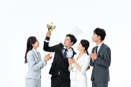 商务团队举奖杯庆祝图片