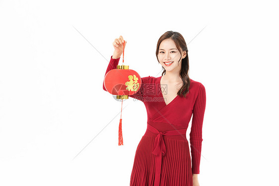新年手拿红灯笼的女性图片