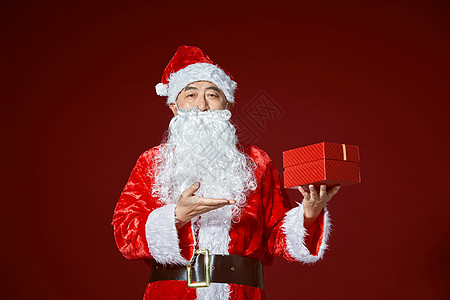 圣诞节人物圣诞老人手拿礼物背景