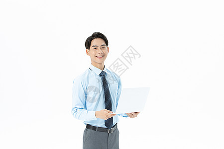 青年商务男性拿着笔记本电脑图片